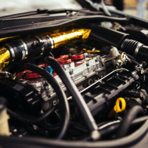 Close-up view of a high-performance car engine revealing intricate mechanical details.