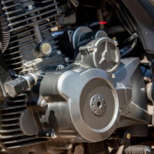 Detailed shot of a motorcycle engine showcasing intricate parts and craftsmanship.